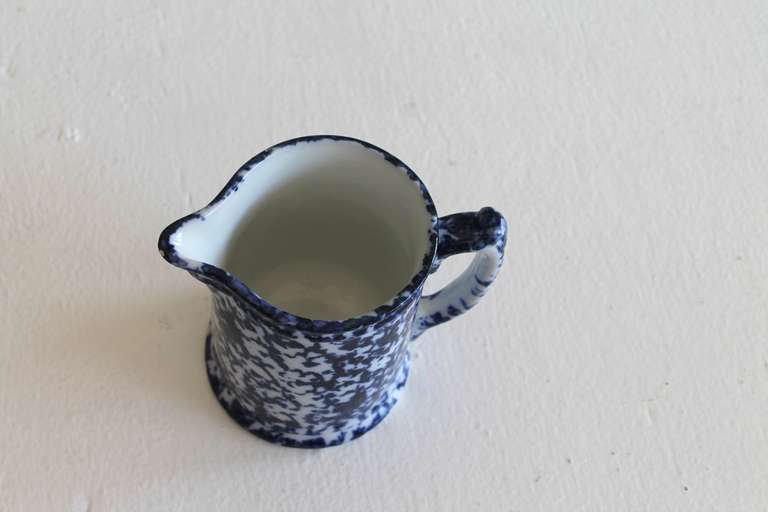 This is a particularly interesting example of a primitive farmhouse spongeware pitcher. The pitcher shows a deep cobalt sponge technique and dates to the late 1800s. This piece was acquired from an historic home in the Black Hills of Western South