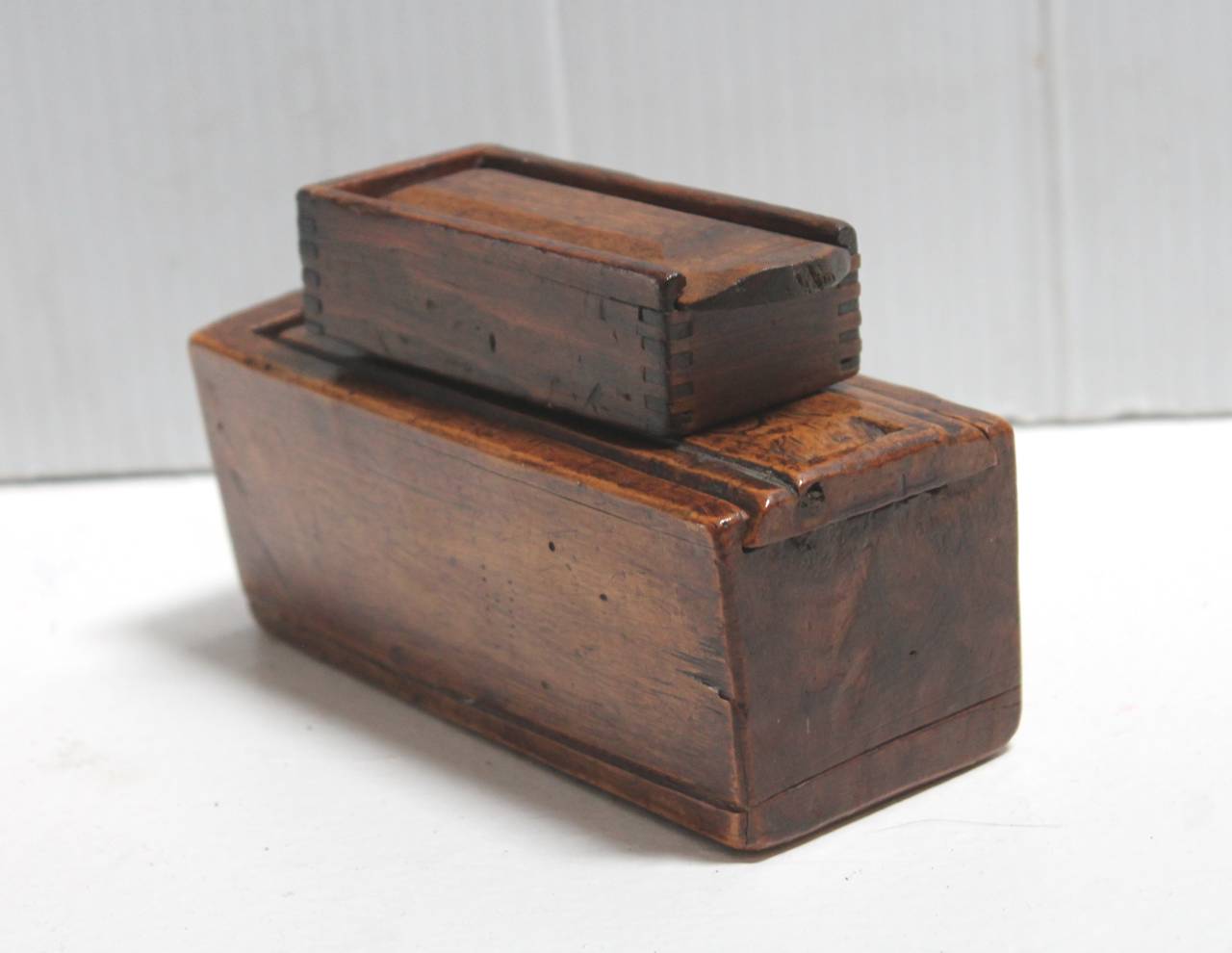 These two boxes are in great condition and are both handmade and carved. The top smallest box is dove tailed and handmade. The second box is hand-carved wood from one piece of wood. The two boxes are different and selling as a pair.