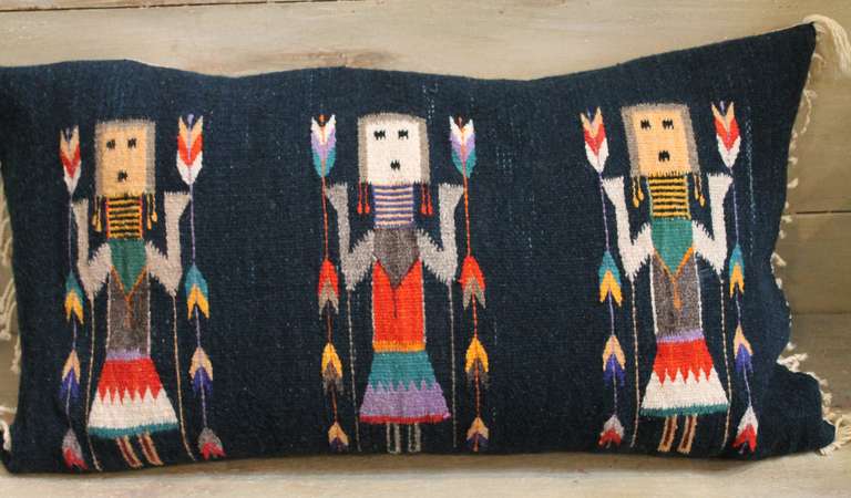 This is a particularly colorful and picturesque version of a Yei Navajo woven pillow.   As represented in this piece, Yeibechai or “Yei” is the Navajo name for supernatural beings believed to impart significant healing powers to participants in