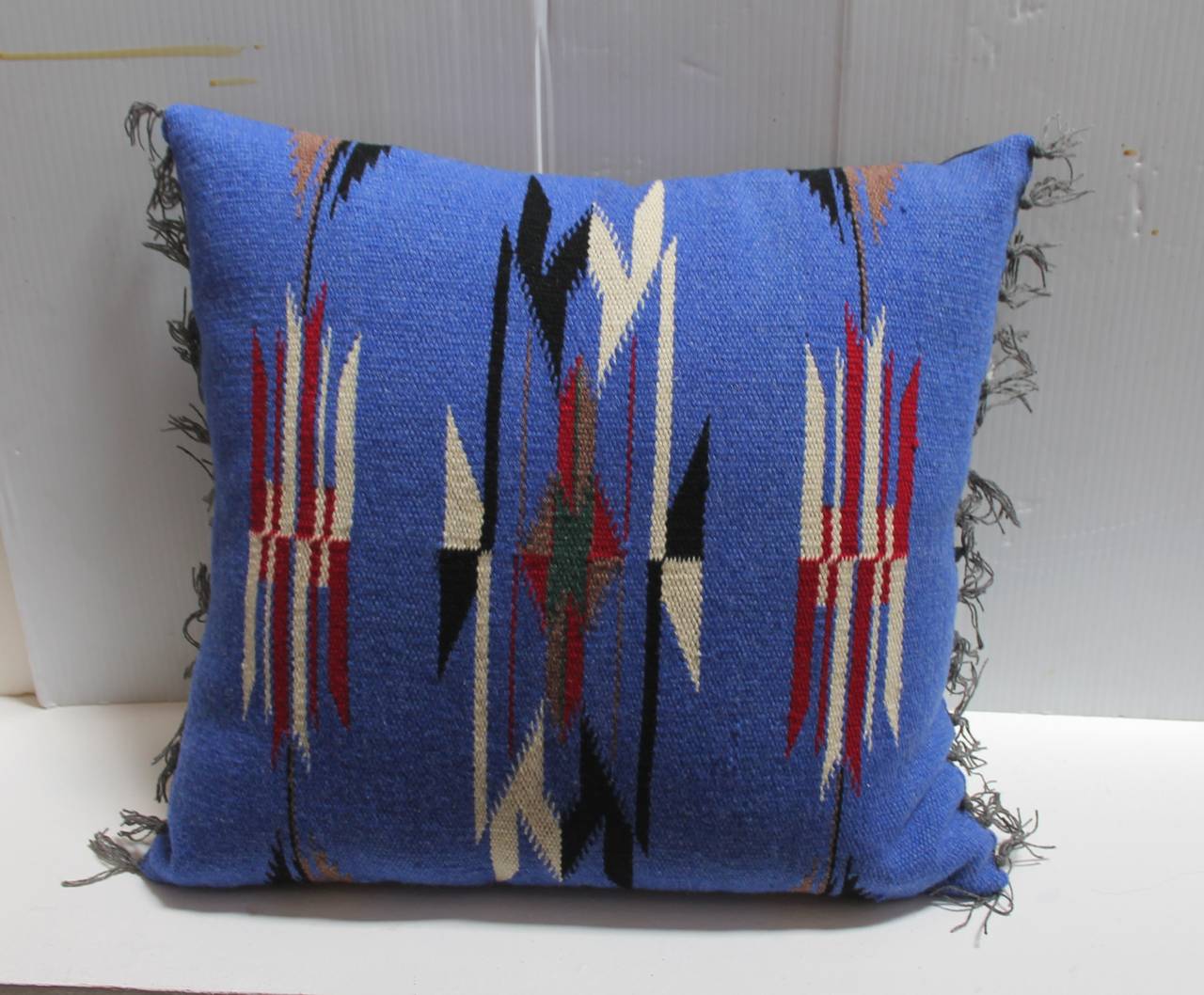 These  Mexican  Indian weaving pillows are so fantastic and vibrant with all the original fringe. This is most unusual to find a matching pair in such good condition. The backing is in a black cotton linen. Zipper closures.