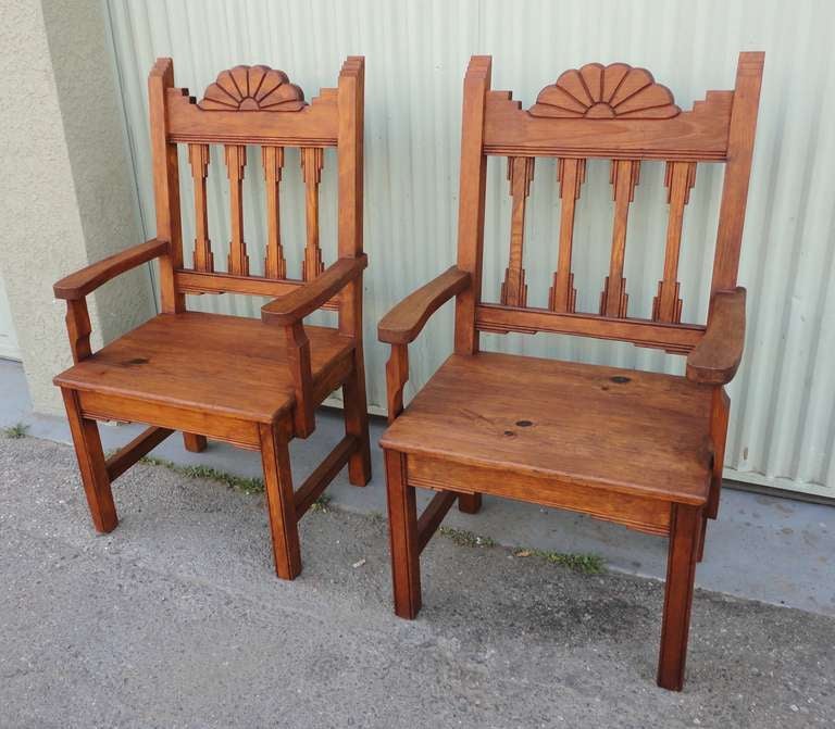 Fantastic pair of  hand carved  chairs from  New Mexico .These wonderful detailed chairs are made of pine and could go inside or outdoors.The chairs are from the forties or fifties and were found in Santa Fe ,New Mexico .They are very sturdy and