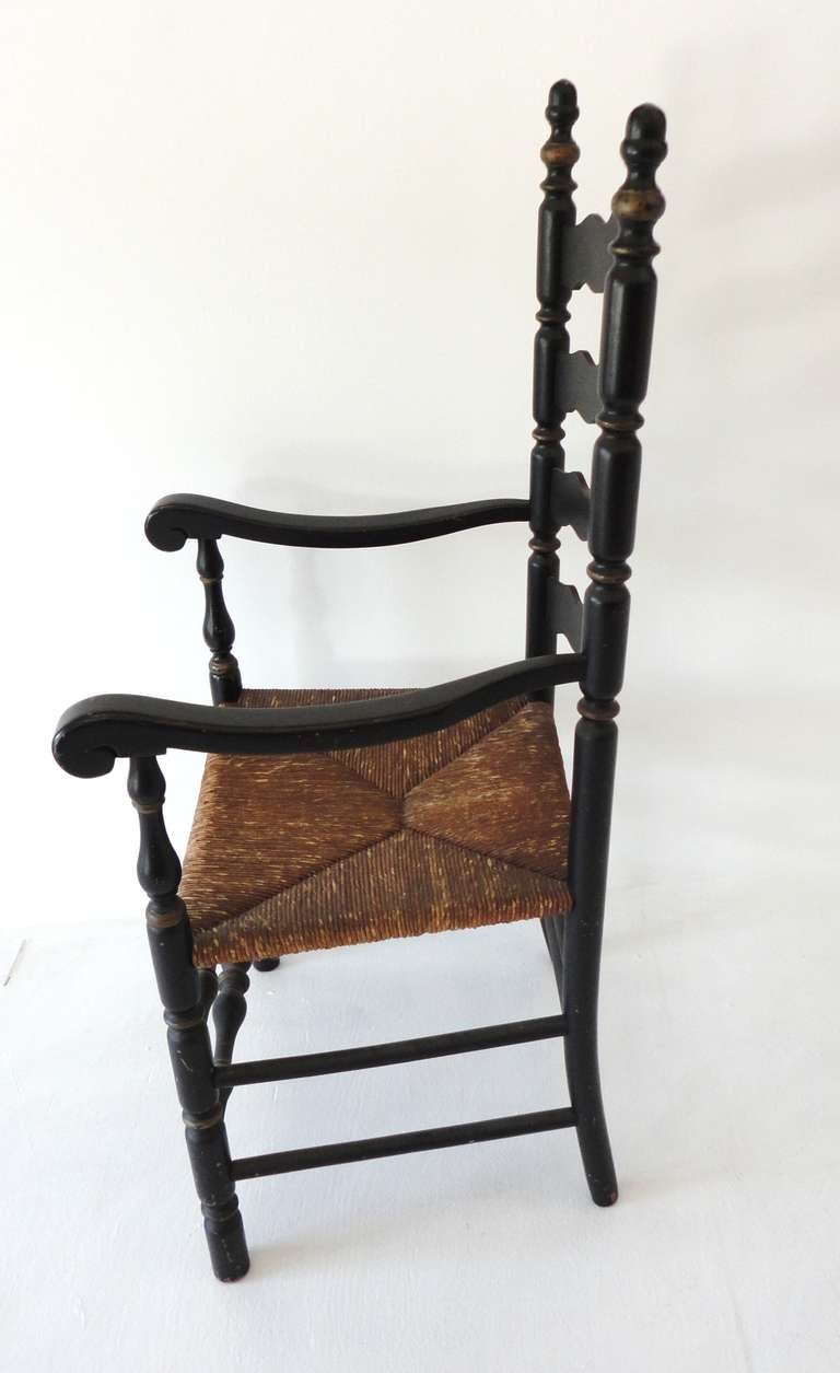 American 19th c. Original Black Painted Ladder Back Armchair from New England