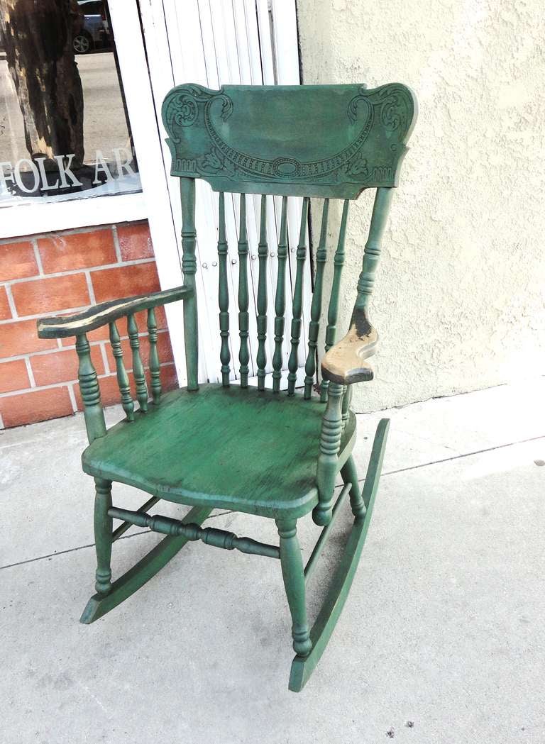 Fantastic 19thc  original green painted pressed back rocking chair from Pennsylvania .This so comfortable  rocker has such wonderful patina and great on a porch or in a living room .It is all original and in super good condition.