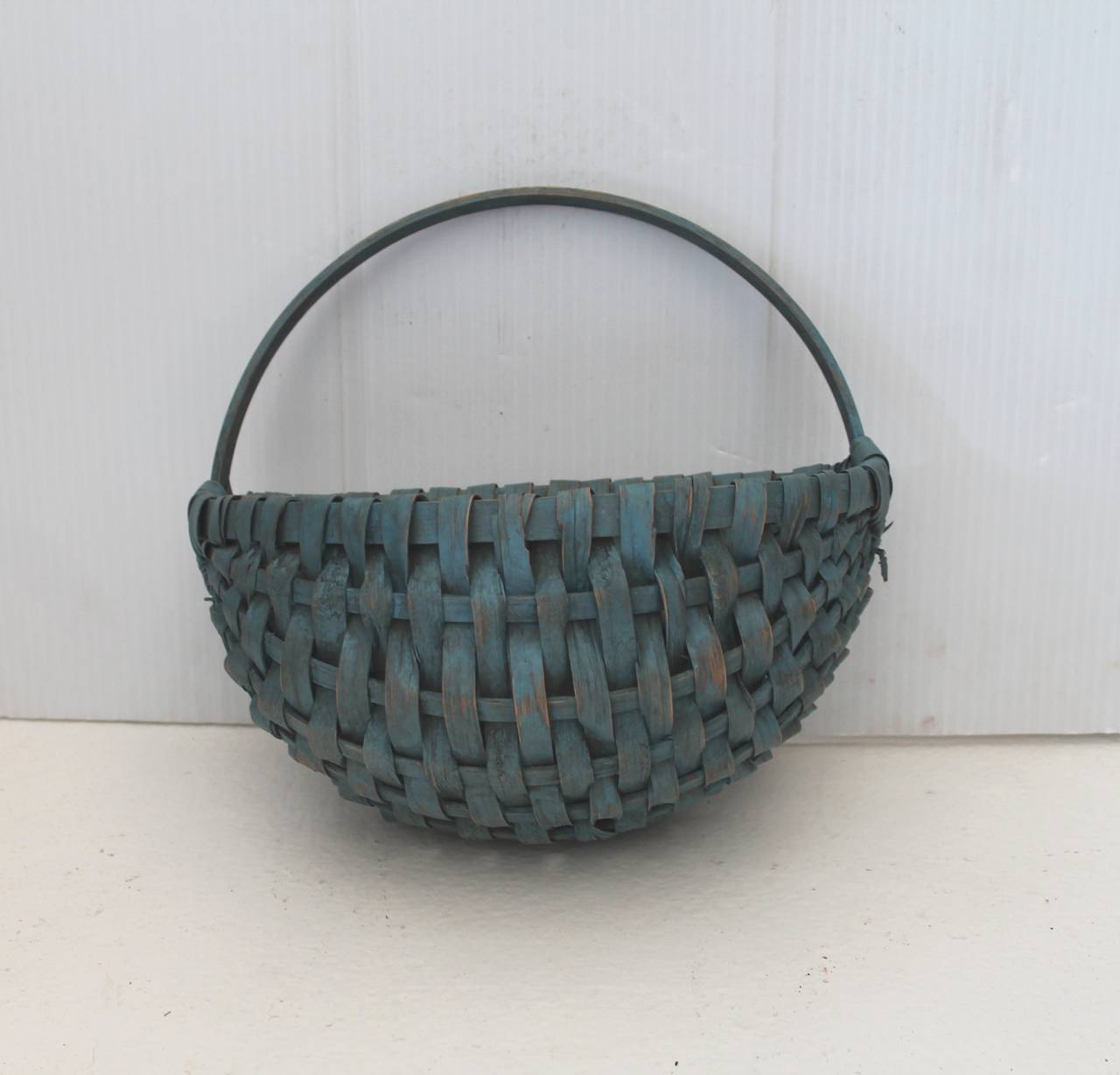 19th century wall or half basket was found in New England and has a great worn yet wonderful surface. This early basket was probably tucked away for years. Condition is very good with minor tiny breaks consistent from age and use. Was found