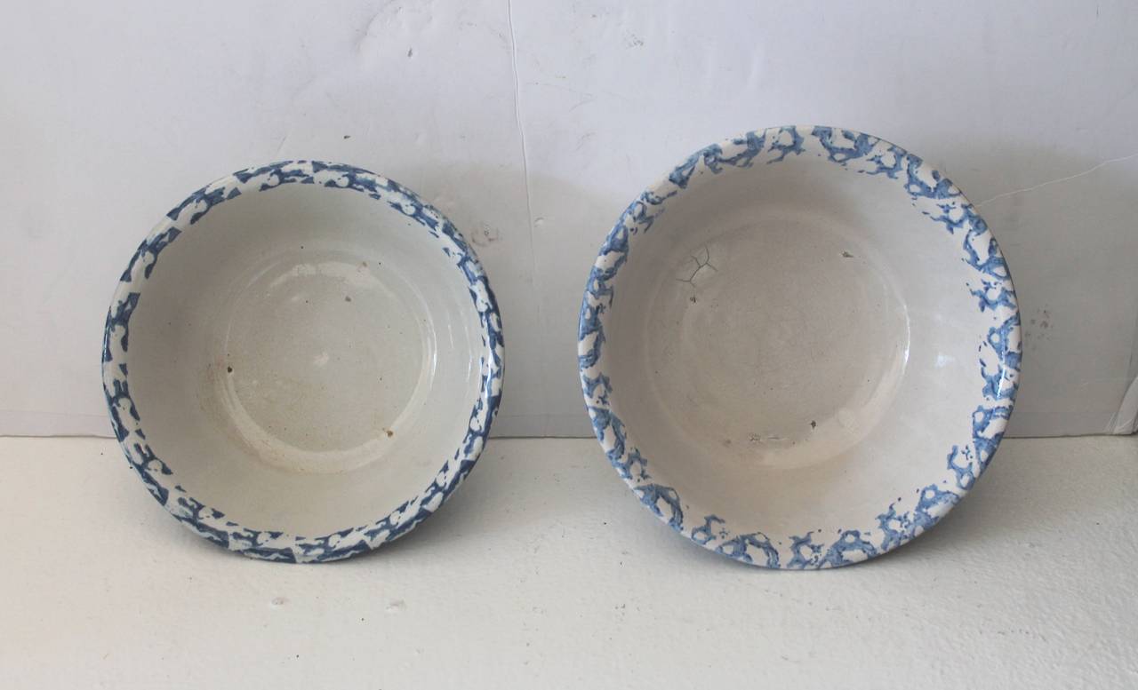 Two different size 19th century spongeware pottery serving or mixing bowls. Both bowls are fluted shape and in mint condition. The smaller of the two is 4
