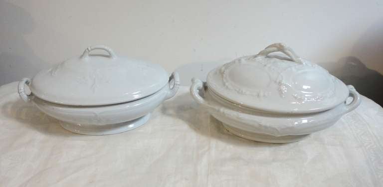 Two English ironstone covered soup tureens in mint condition. The one to the right is stamped Challings, England it has grapes and grape vines embossed through out. This is 12 long x 7 high and 8 deep. The tureen to the left is 12 long x 8 deep and