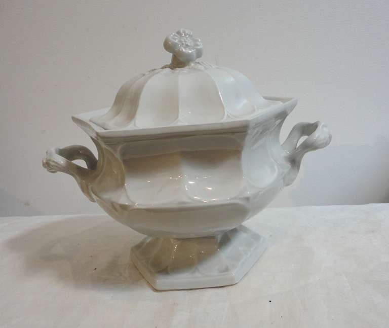 19th century English ironstone serving tureen with floral lid and handles. This six sided tureen has a very unusual shape and form. The condition is very good and bright white. This two-piece tureen is in great condition.