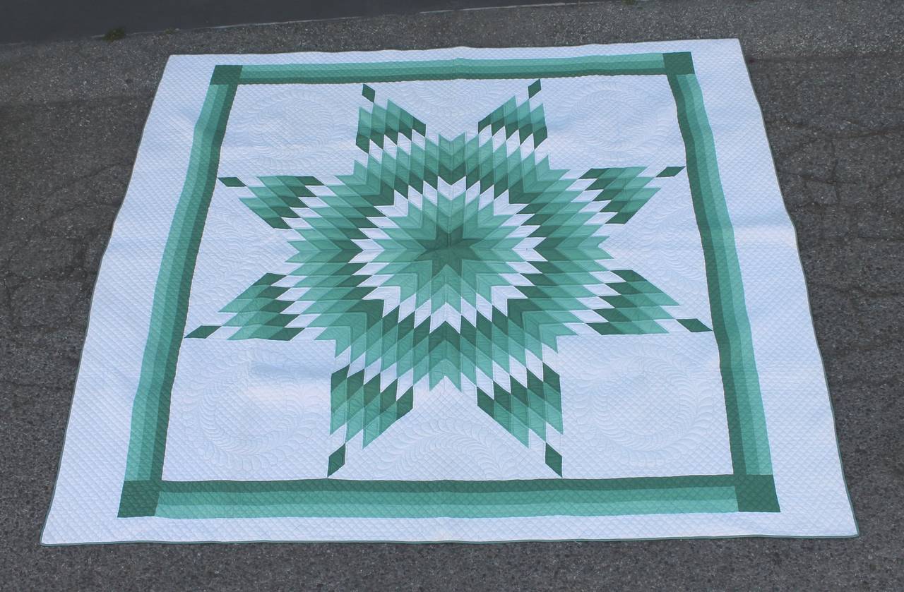 Wow this is a real beauty has all the bells and whistles. The quilting is the very best and condition is pristine. This three colored star is very well pieced and graphic. Very tight quilting with 12 stitches per inch.