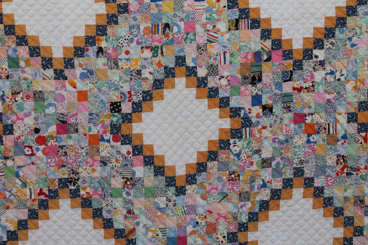 This is really an interesting and most unusual pattern quilt. The small postage stamp pieces are very well pieced and nice tight stitching. The triple blue and white calico border has floating bricks of cheddar blocks. This quilt is in pristine