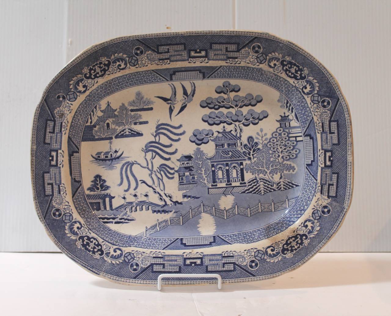 19th century blue and white Staffordshire England ironstone serving platter. This fine example of early blue willow is great as a serving platter or great hanging on the wall. The condition is very good with minor crazing. No cracks or chips.