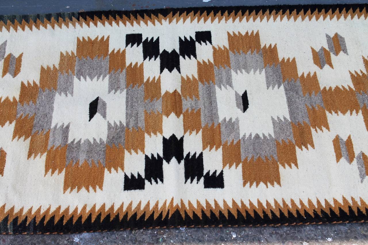 This weaving has a great saw tooth border on both sides and a simple geometric center. The colors are calming but sharp. The condition is very good.