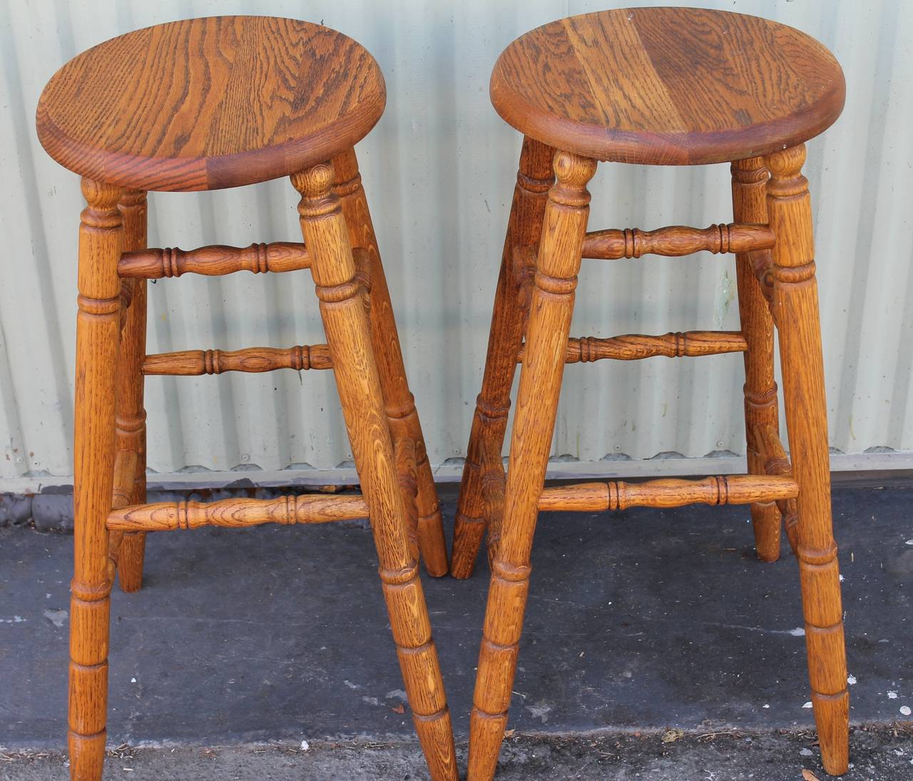 This pair of rustic and natural oak bar stools in great as found condition. The pair have great height and very sturdy. Wonderful worn surface.