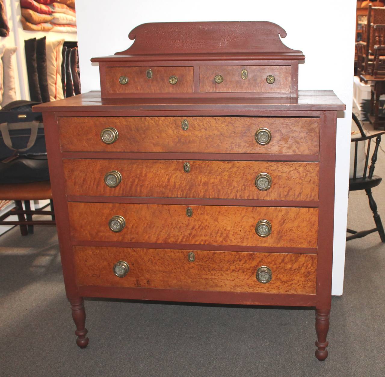 Early 19th century high country original red painted chest of drawers from Bridgton, Maine. The construction is the very best with dovetailed drawers and shamford backing. The brass pulls and hardware are all original. Take notice to the Sheraton