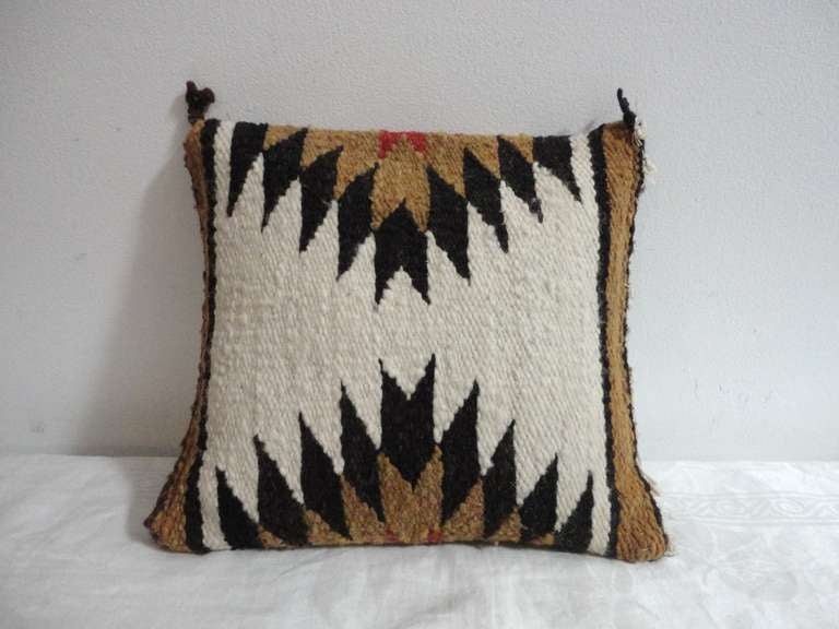 Amazing colors and size Navajo Indian weaving sample pillow.This fun eye dazzler is great with a group of others in similar colors.The condition is good with a chocolate brown cotton linen back.