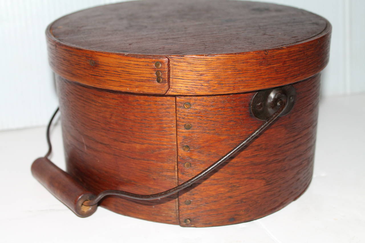 This 19th century bail handled natural old surface bail handled pantry box is from Pennsylvania and is in great as found condition. The top lid of the box is signed by the maker but is worn that is hard to read. The condition is very good and