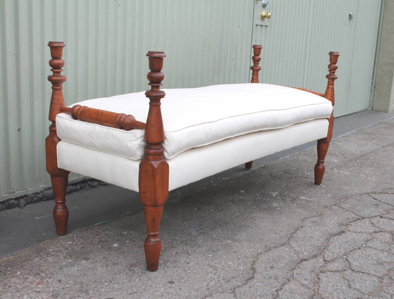 This amazing early 19th century hand-carved daybed in bird's-eye maple is in amazing as found condition. The patina is the very best in this bench frame. This early bed can serve as a bench in a window seat or in front of a bed. The turnings are