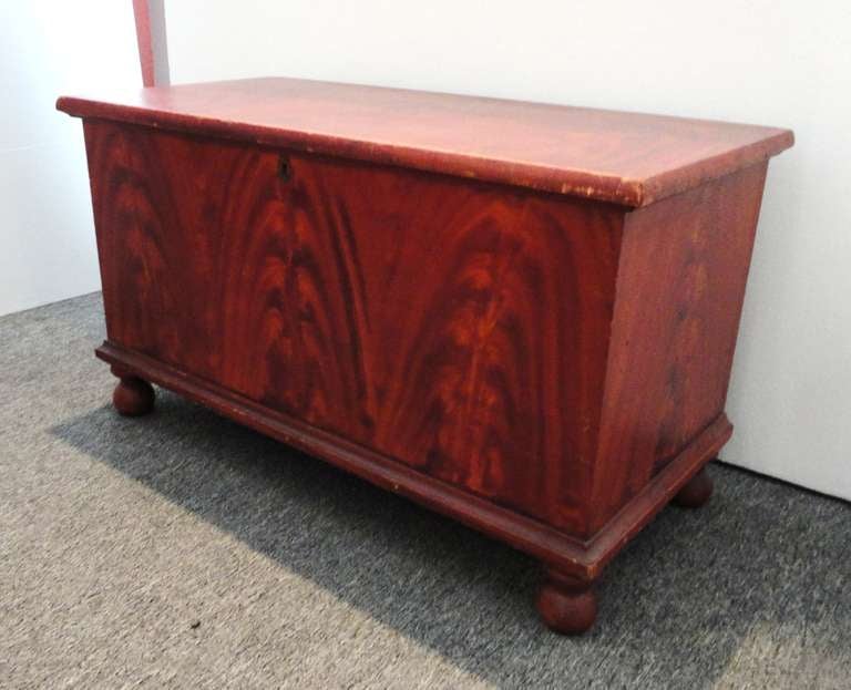 This is a amazing untouched 19thc original paint decorated blanket chest is a small scale size.Wonderful as a coffee table or end of a bed for quilts & blankets.The condition is very good and is dovetailed construction with all original bun feet