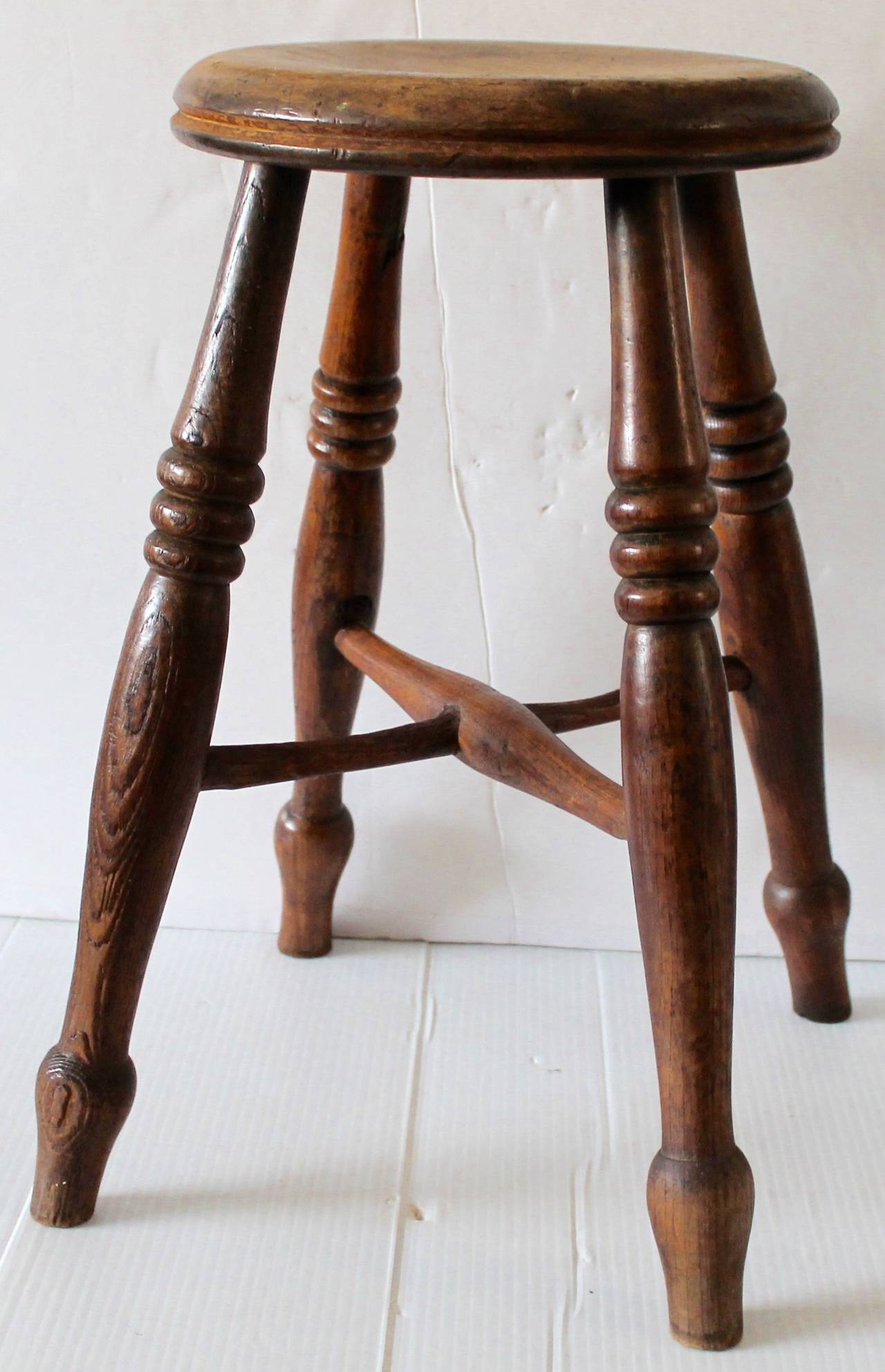 This is such a nice country hand made stool from the early 19thc and in walnut wood. The condition is good and sturdy.
