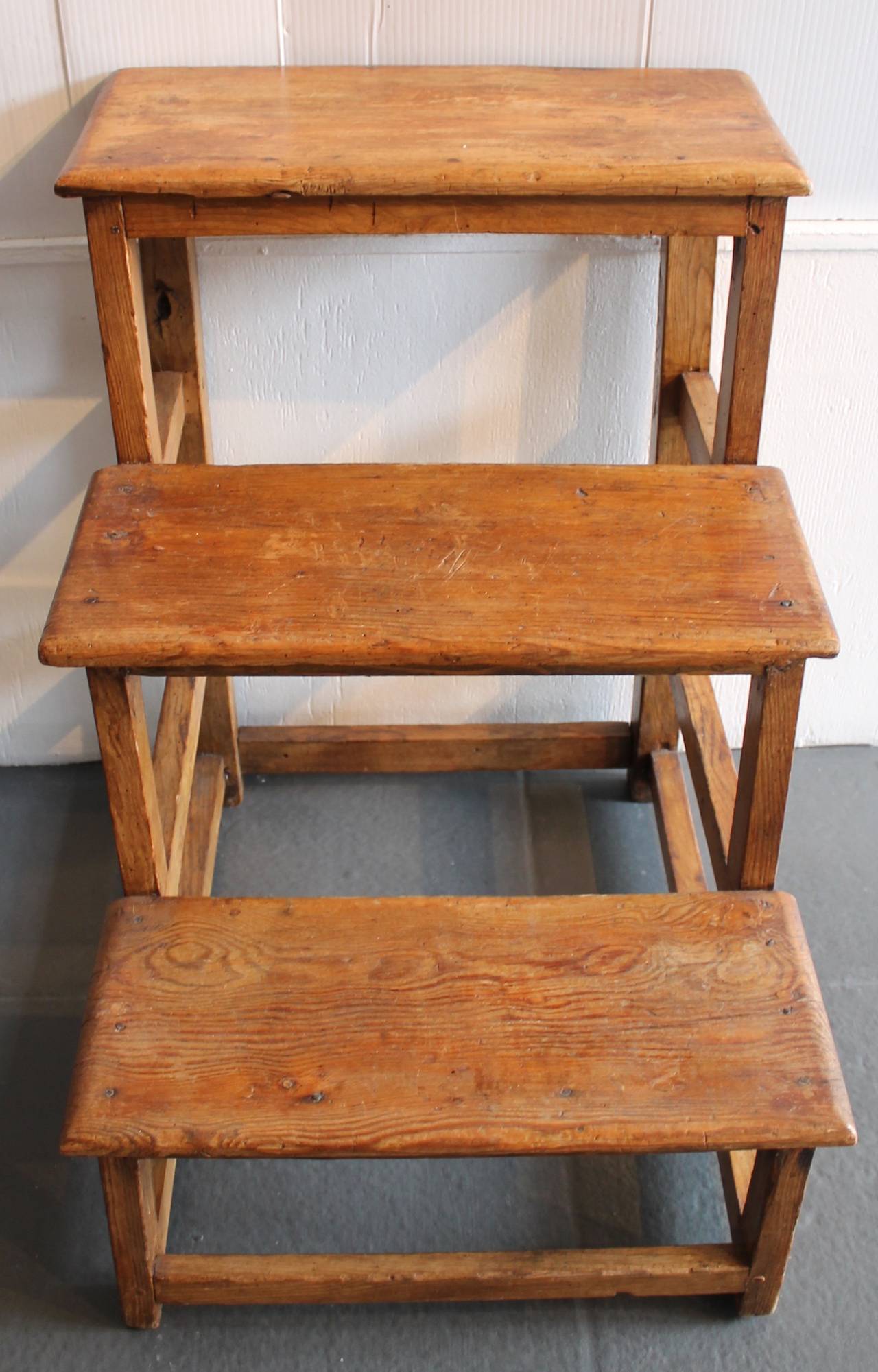 These early steps are in great as found condition with square nail and wood peg construction. They are strong and sturdy too. These steps are great for display or as stair steps. Wonderful worn patina.