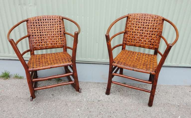 This matching pair of Old Hickory rocking chair and matching arm chair are in pristine condition and both stamped by the maker on the back legs of the chairs. The pair of chairs are in wonderful and  sturdy condition.The surface is very good and