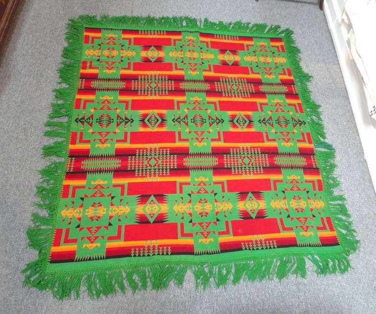 Fantastic and colorful original   early wool Cayuse Pendleton Indian design camp  fringed blanket .This early and rare blanket has the original dated 1909 satin label . The condition is very good with a tiny small repair the size of a dime as seen