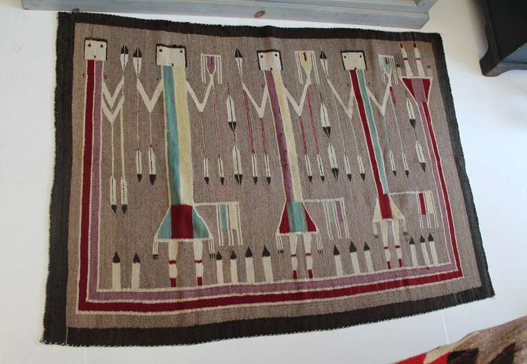 This exceptional and early Navajo Yei weaving is from a reservation in the southwest region of Arizona.  Inspired by Navajo sand painting, this piece dates to the early 1930’s.  Pictured in this weaving are Yei, or Navajo religious figures