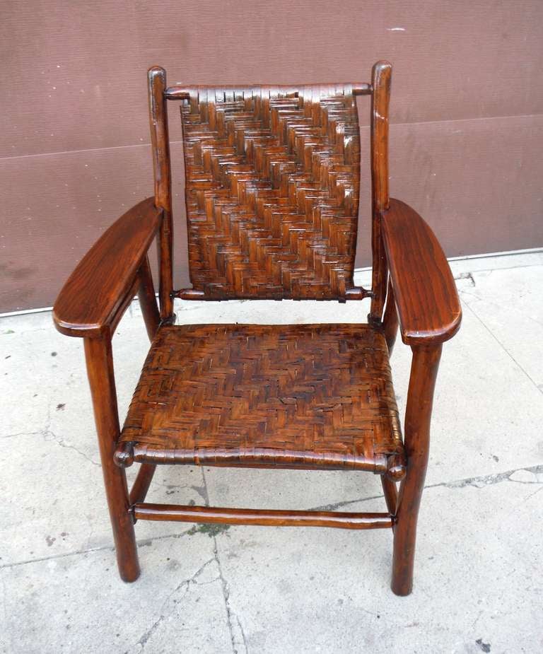 Wonderful patina and natural old surface signed Old Hickory arm chair.This is signed on  the lower right back leg ,Old Hickory Furniture Co. ,Martinsville ,Indiana .This has all original woven seat and back .It is in in very good and sturdy