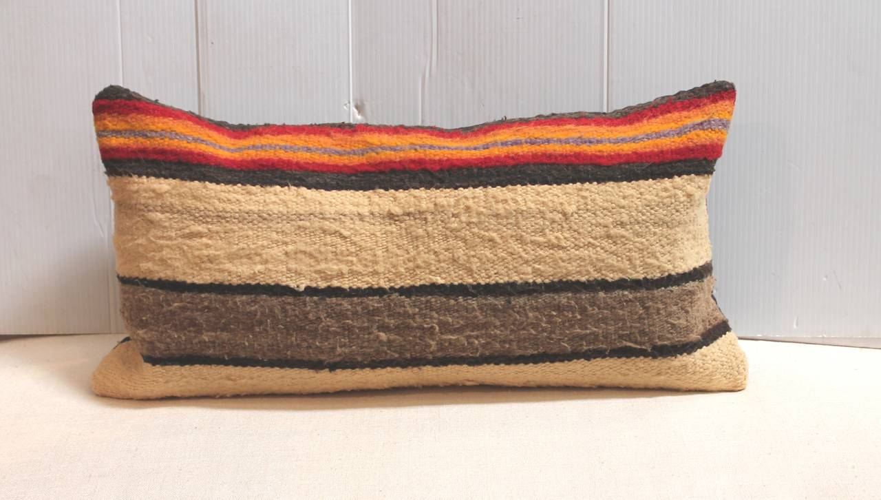Navajo Indian weaving saddle blanket pillows in simple striped pattern. Black cotton linen backing. The inserts are down and feather fill. Sold as pair.