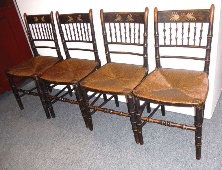 Fantastic original painted surface 19thc Early New England Hitchcock chairs with the original hand woven rush seats.The condition are very good and sturdy with a wonderful untouched surface.There is wear and worn surface in areas but does not effect