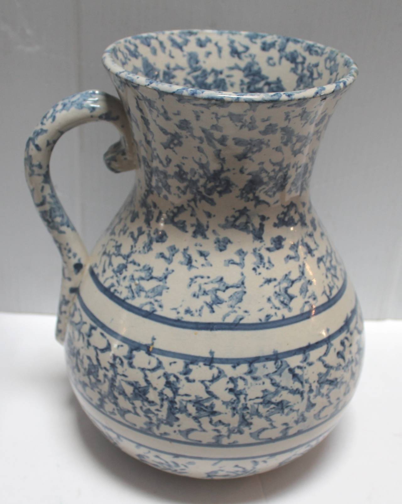 Wow this is a very big water pitcher or jug. This 19th century sponge ware pitcher has wonderful bands and pattern both inside and out. The condition is pristine and wonderful light blue colors. It is unsigned as all sponge ware pottery is unmarked.
