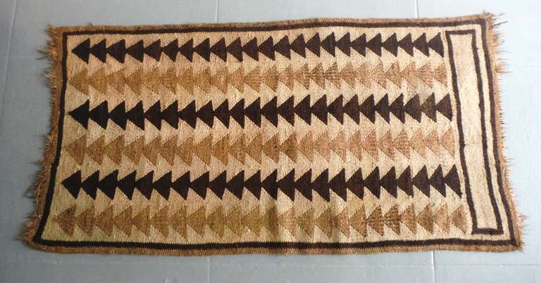 This wonderful Indian  hand woven geometric area rug is in great condition and is quite durable.The rug has a fringed border on both ends .This is a South American Indian woven   area rug. The weight is heavy .