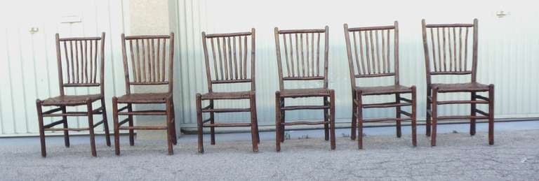 This amazing set of six matching signed Old Hickory ,Martinsville ,Indiana chairs are in wonderful condition with a natural stained finish and coated with a out door ,all weather protector coat for indoor or out side.This is just a coating of