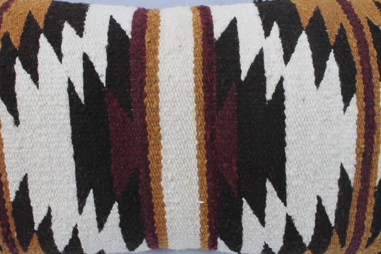 Fantastic Navajo Indian weaving geometric broken star pattern. The condition is pristine with a black cotton linen backing. The colors are black and brown with a cream ground.