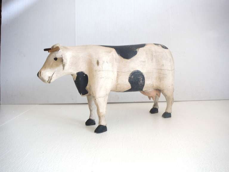 This wonderful large hand carved and painted cow is in good condition and has a wonderful worn patina.Condition is good with minor chips and slight age cracks but is in very good condition.