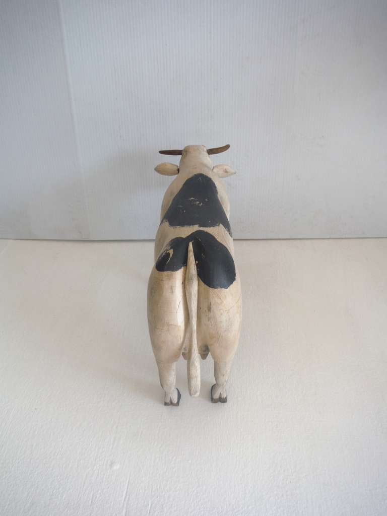 carved wooden cow