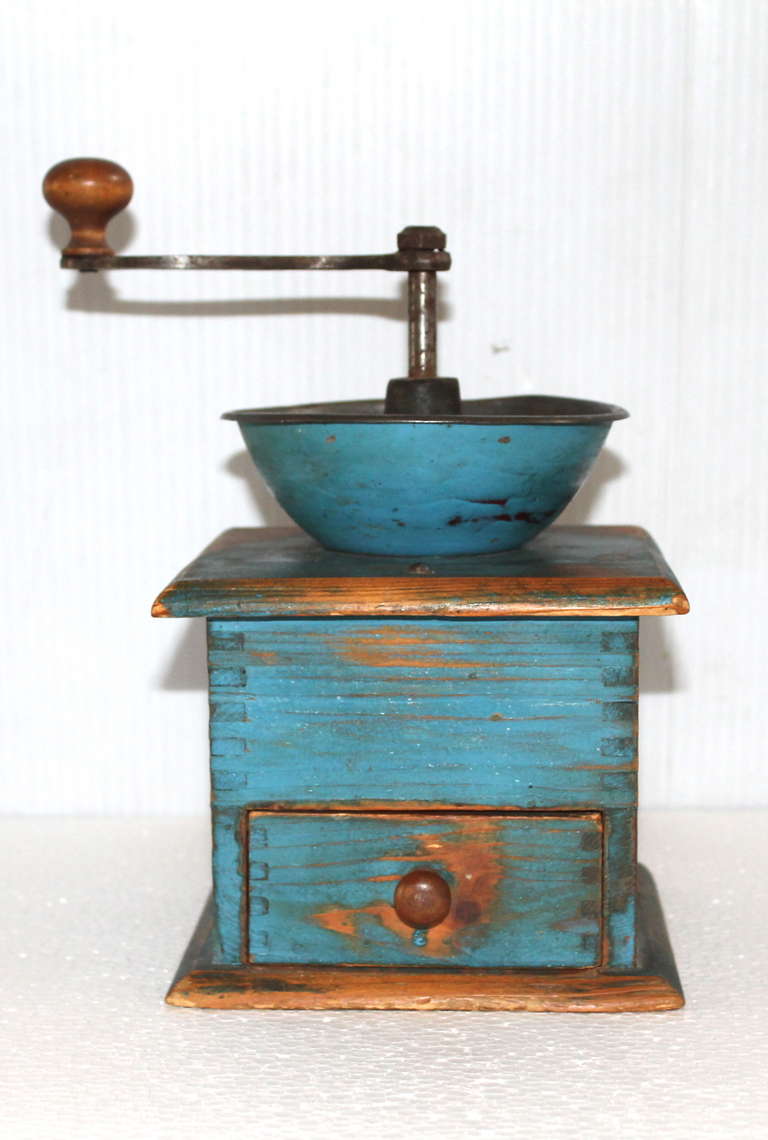 Fantastic and vibrant original robin egg blue painted 19thc coffee grinder with a dovetailed case and drawer. This has the most amazing untouched surface and is in working order. This coffee grinder was found in Pennsylvania.