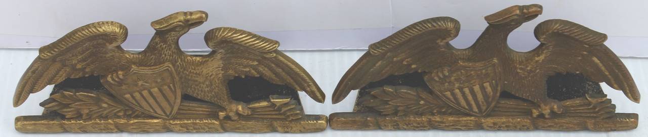 This pair of solid brass are in great as found condition. This is a large oversize eagle flanked on a patriotic shield and arrows. Signed Spread Eagle 1952 Va. Metal crafters.