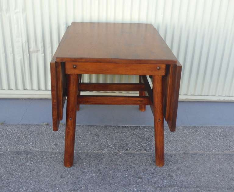 This is the best rustic drop-leaf dinning table for your home or cabin in the mountains. It is signed Rittenhouse Furniture Company, Cheboygan, Michigan. The condition is very good and very sturdy. This works so well with Old Hickory furniture or