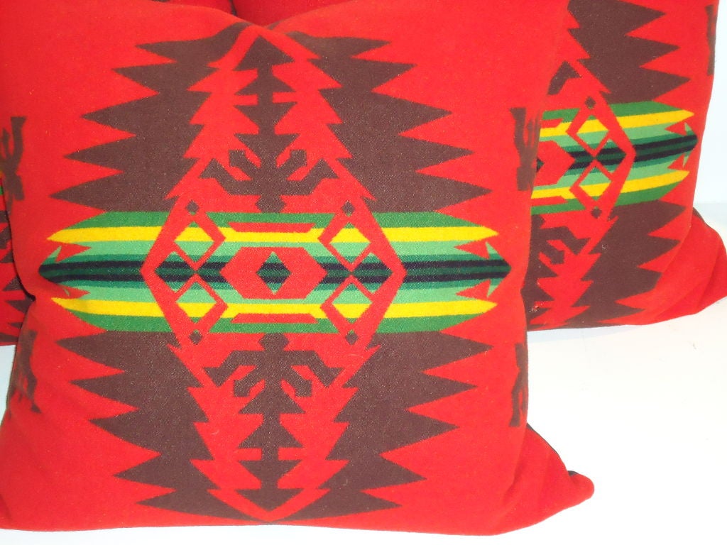 WONDERFUL RED GROUND WOOL PENDLETON BLANKET PILLOWS WITH BROWN LINEN BACKING.DOWN & FEATHER FILL.SOLD INDIVIDUALLY AT 395.EACH/ ONLY THREE LEFT IN STOCK.