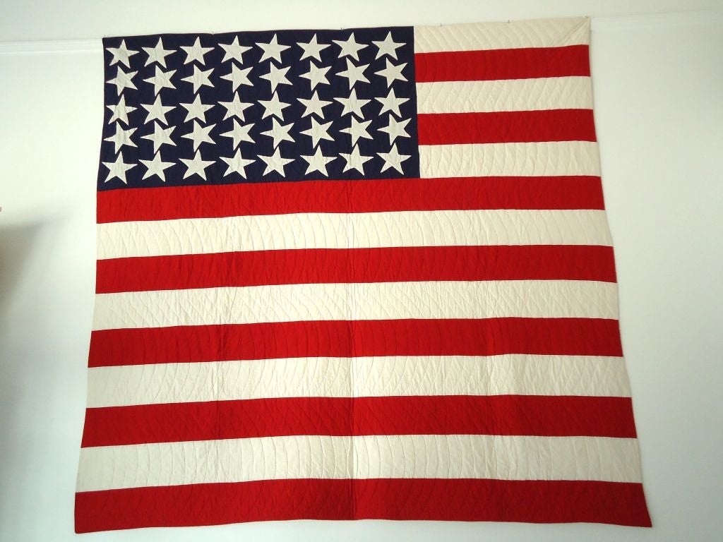 THIS FOLKY PIECE OF AMERICAN FOLK ART IS IN MINT CONDITION.THIS FORTY STAR HAND SEWN FLAG QUILT HAS GREAT PRESENTS AND COMES FROM A PRIVATE QUILT COLLECTION IN PENNSYLAVANIA.THE QUILT IS A LARGE AND QUITE UNUSUAL SHAPE.THE QUILTING IS TIGHT  AND