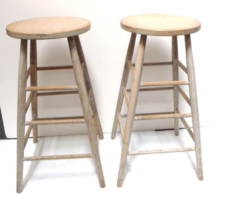 This is the most amazing pair of tall counter or bar stools from New England with a original white washed painted surface.The condition are very good with a original furniture paper label underneath the seat of one stool. This is a hand made pair of