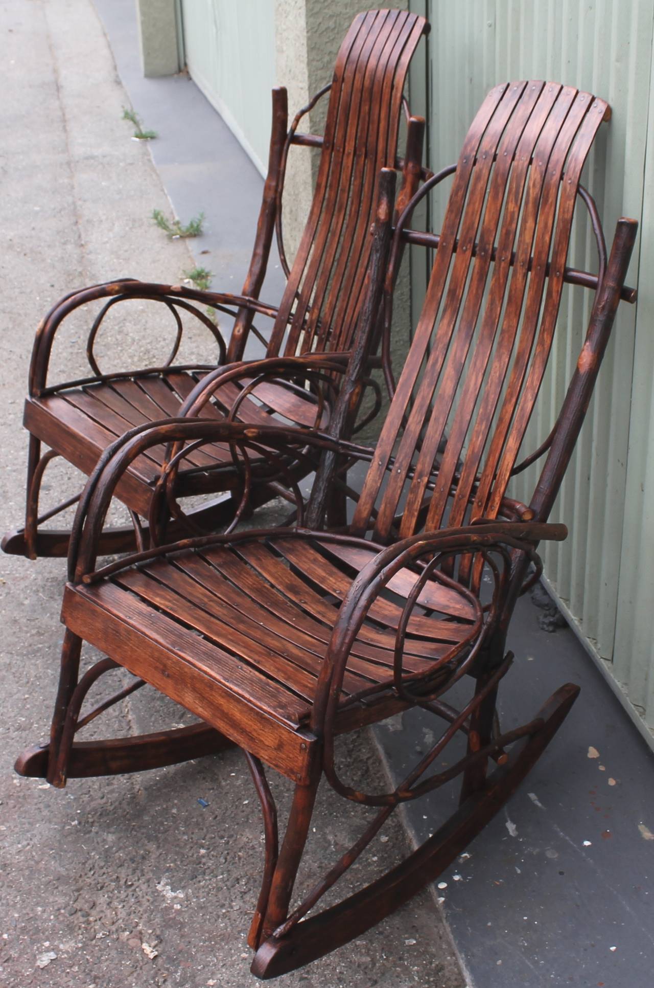 This pair of Amish twig rocking chairs are in amazing as found condition. These chairs were made in the state of Indiana and originally made by the Amish and now made in state prisons throughout the East coast. Its very rare to find a pair of