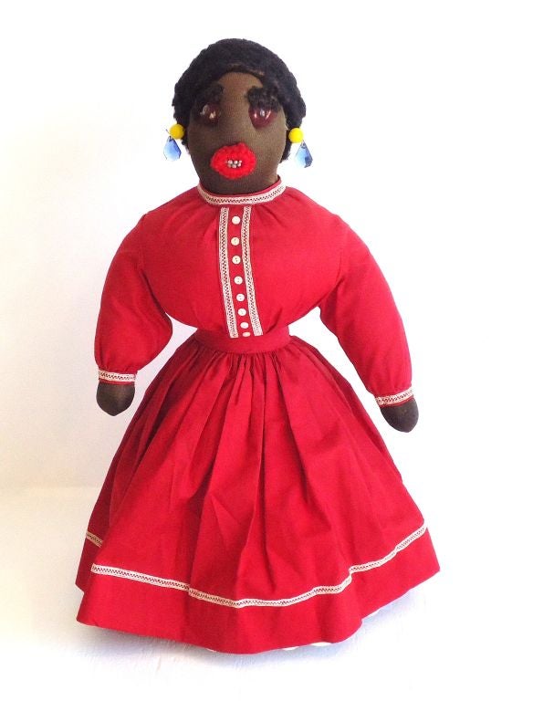 FANTASTIC FOLKY 19THC BLACK BOTTLE DOLL IN GREAT AS FOUND CONDITION.THIS FUNKY GIRL HAS GREAT HAIR AND BIG VICTORIAN GLASS EARINGS.HER CLOTHING IS ALL ORIGINAL WITH A TURKEY RED DRESS TRIMED IN EARLY HANDMADE LACE W/SMALL PEARL BUTTONS.SHE IS