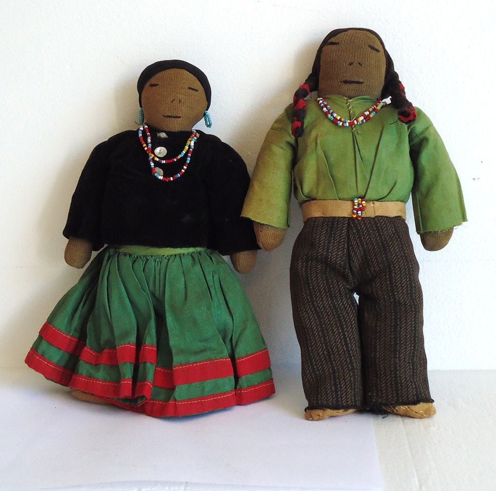 THIS PAIR OF AMERICAN INDIAN FABRIC DOLLS ARE SPECTACULAR.THEY ARE APACHE AND HAVE ALL THE ORIGINAL HANDMADE CLOTHING AND BEADWORK.HER SHIRT IS VELVET W/HANDMADE TIN BUTTONS AND MUSLIN BEADED BOOTS.HE HAS HANDMADE WOOL PANTS AND COTTON MUSLIN