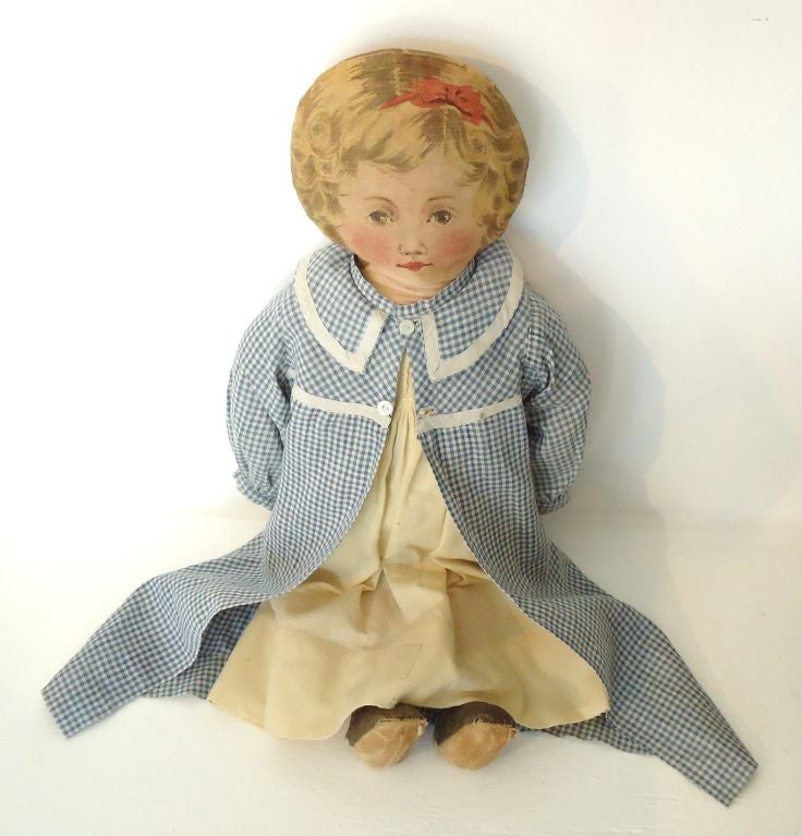 Folky 19thc Original printed litho fabric doll with 19thc cream colored homespun dress and a top Gigam dress, all hand made clothing. This very folky girl has printed face, booties, and body. Condition is very good. 

