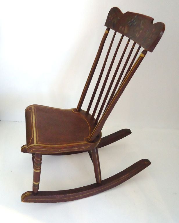 WONDERFUL 19THC PAINT DECORATED ROCKING CHAIR WITH STENCIL FRUIT FROM LANCASTER COUNTY, PENNSYLVANIA.FANTASTIC ORIGINAL PAINTED DETAILS.THIS ALSO HAS THE ORIGINAL MUSTARD PAINTED PIN STRIPED TRIM.THIS ROCKER IS VERY CONFERTABLE AND IN VERY GOOD