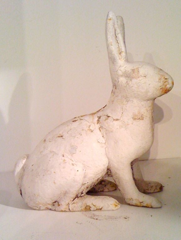 FOLKY & COOL OLD PAINTED WHITE CAST IRON RABBIT GARDEN ORNAMENT.WHAT A GREAT LOOK AND WOULD MAKE A GREAT DOOR STOP.THE CONDITION IS GOOD.THE PAINT IS OLD BUT I AM SURE IT HAS BEEEN PAINTED WHITE TIME AND TIME AGAIN TO WITHSTAND THE OUTDOORS.