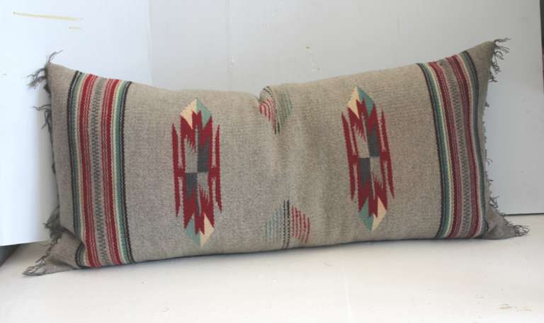 This wonder hand woven Mexican American weaving bolster pillow is in great condition. It has a grey linen backing and original fringe. Grey and red and cream colors. The insert is down and feather fill.