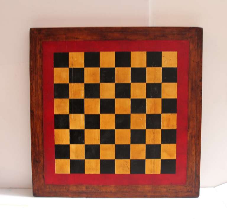 Early 20thc Original painted &  double sided game board in red,mustard and black. The back round is in a dirty mustard ground . The patina or surface is the very best. The back of board is in a Chinese checkers made for marbles ! This is a very