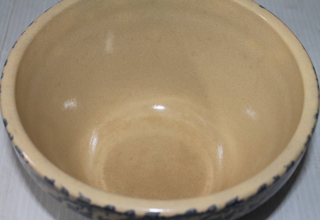 This early 20th century mixing bowl comes from a rare collection of spongeware. This item has been well taken care of and is in pristine condition. There is minor wear that is consistent with its age.